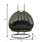 LeisureMod 2-Person Hängesessel mit Ständer – Outdoor/Indoor Rattan Korbsessel Garten-Schaukelhängematte mit Kissen