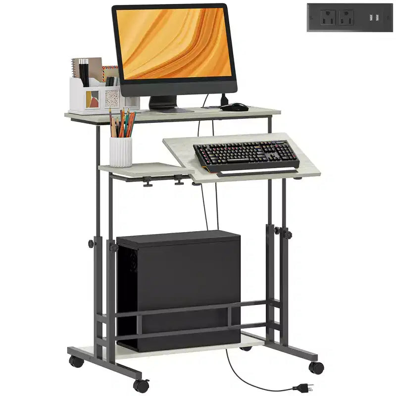 HOMCOM Standing Desk with Power Outlets, Height Adjustable Stand Up Desk with Tiltable Tabletop, Lockable Wheels, Shelf, for Home Office