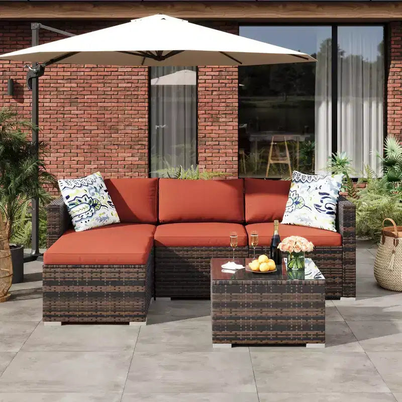 4-teiliges Terrassenmöbel-Set für den Außenbereich, Rattan-Sitzgruppe, Bistro-Gartenmöbel-Set mit 2 Stühlen, weichen Kissen, Zweisitzer-Sofa und 1 Couchtisch aus Glas