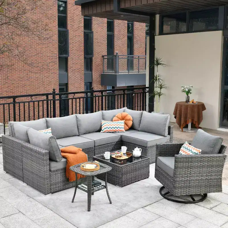 Ovios Venice 9-teiliges Gartenmöbelset aus Korbgeflecht, Konversationssofa, Sektionalsofa mit Drehsessel und Kissen