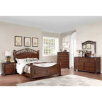 Holzbett mit geschnitztem Kopfteil aus dunkler Kirsche